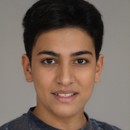 Joyful latino young-adult male with short  brown hair and brown eyes