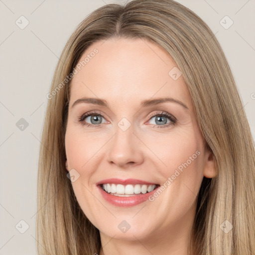 Joyful white young-adult female with long  brown hair and green eyes