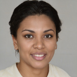 Joyful latino young-adult female with short  brown hair and brown eyes