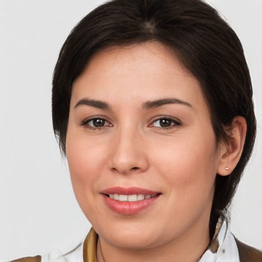 Joyful white young-adult female with medium  brown hair and brown eyes