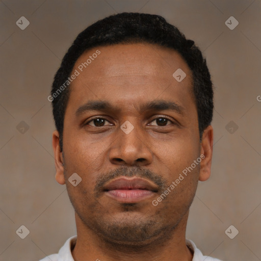 Neutral latino young-adult male with short  black hair and brown eyes