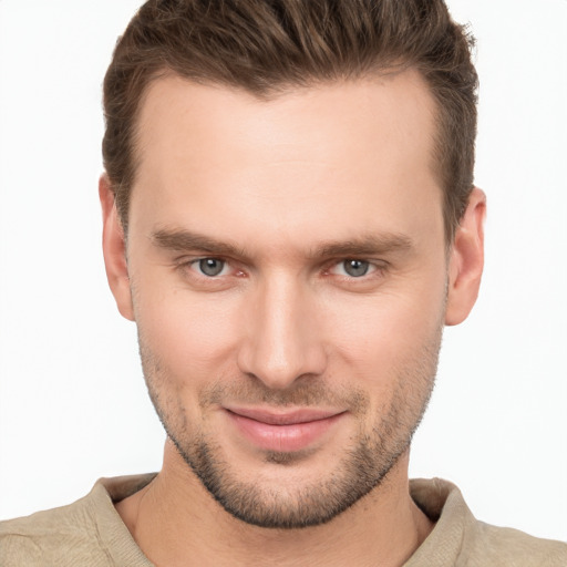 Joyful white young-adult male with short  brown hair and brown eyes