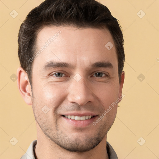 Joyful white young-adult male with short  brown hair and brown eyes