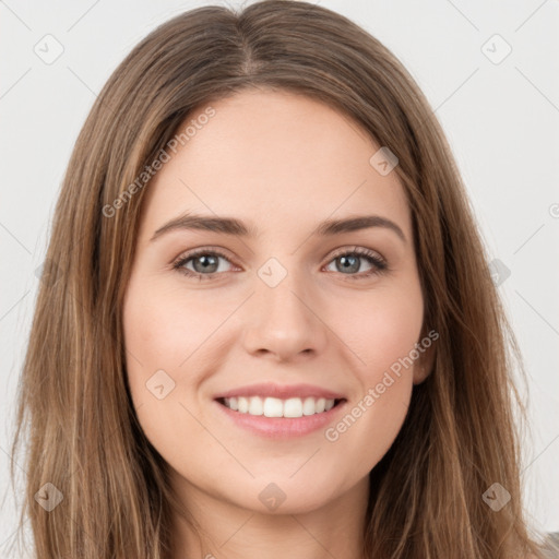 Joyful white young-adult female with long  brown hair and green eyes