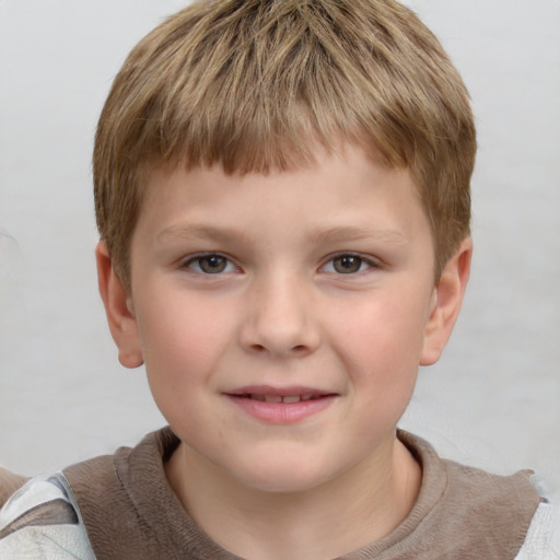 Joyful white child male with short  brown hair and grey eyes