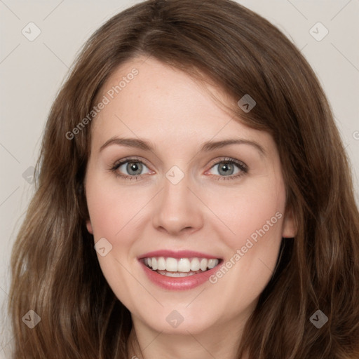 Joyful white young-adult female with long  brown hair and green eyes