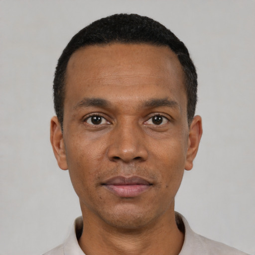 Neutral black adult male with short  black hair and brown eyes
