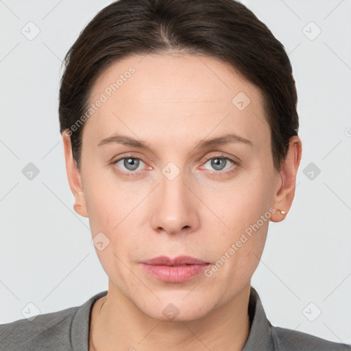 Neutral white young-adult female with short  brown hair and grey eyes