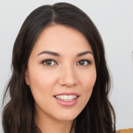 Joyful white young-adult female with long  brown hair and brown eyes