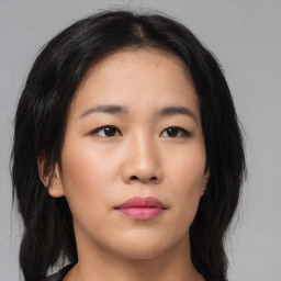 Neutral asian young-adult female with medium  brown hair and brown eyes