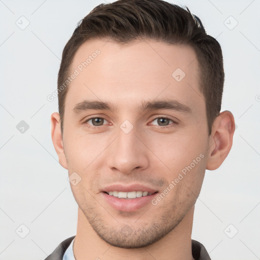 Joyful white young-adult male with short  brown hair and brown eyes