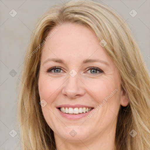 Joyful white adult female with long  brown hair and brown eyes