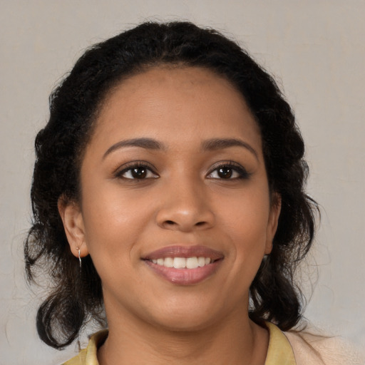 Joyful latino young-adult female with medium  brown hair and brown eyes