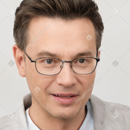 Joyful white adult male with short  brown hair and grey eyes