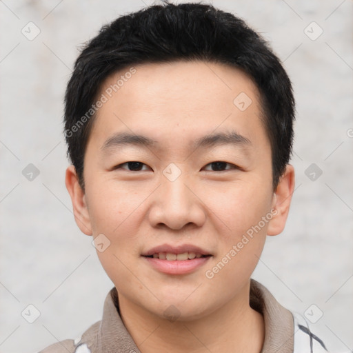 Joyful asian young-adult male with short  black hair and brown eyes