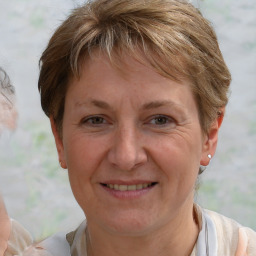 Joyful white adult female with short  brown hair and brown eyes