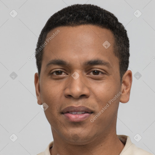 Joyful black young-adult male with short  black hair and brown eyes