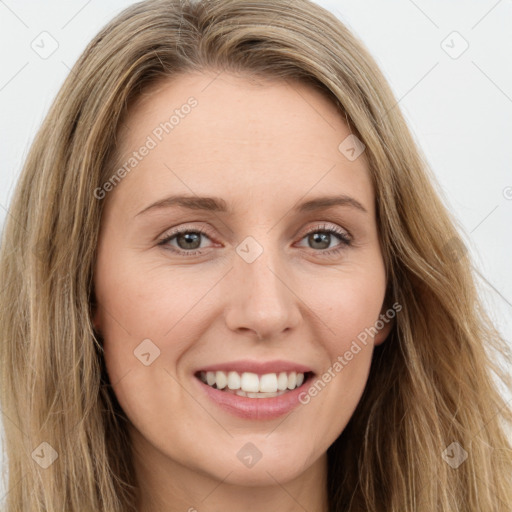 Joyful white young-adult female with long  brown hair and green eyes