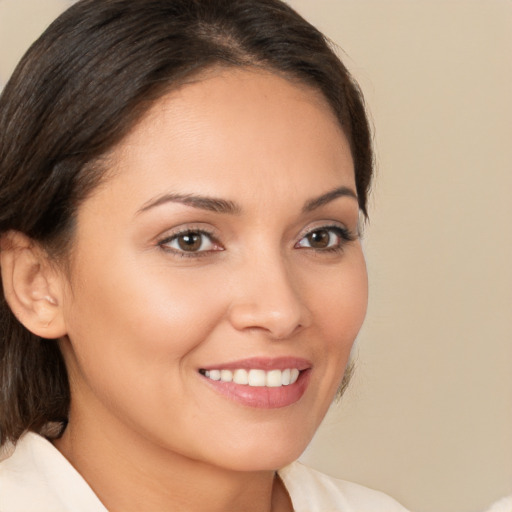 Joyful white young-adult female with medium  brown hair and brown eyes