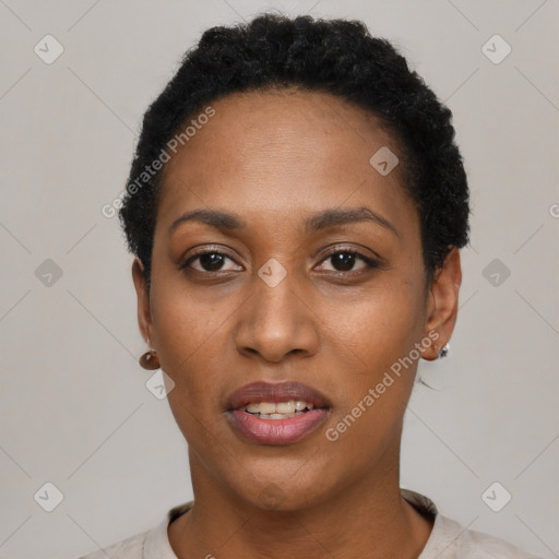 Joyful black young-adult female with short  black hair and brown eyes