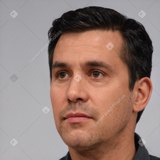 Neutral white adult male with short  black hair and brown eyes