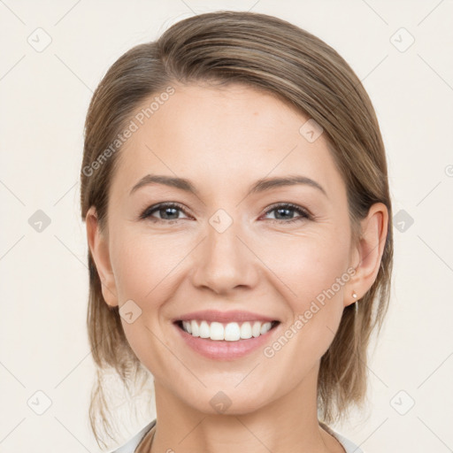 Joyful white young-adult female with medium  brown hair and grey eyes