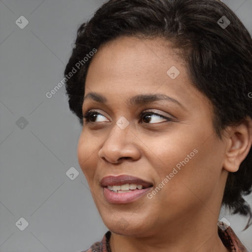 Joyful black young-adult female with medium  brown hair and brown eyes