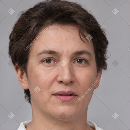 Joyful white adult female with short  brown hair and brown eyes