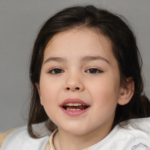 Joyful white child female with medium  brown hair and brown eyes