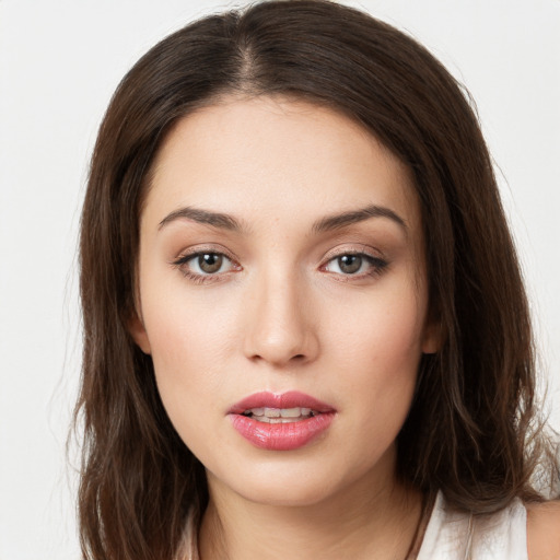 Neutral white young-adult female with long  brown hair and brown eyes