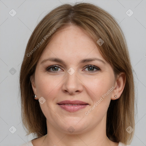 Joyful white young-adult female with medium  brown hair and grey eyes