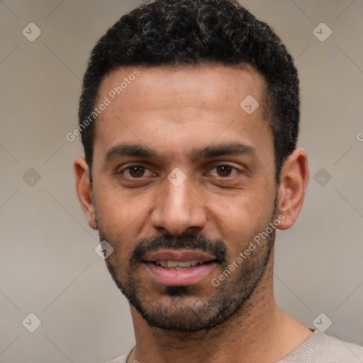 Joyful latino young-adult male with short  black hair and brown eyes