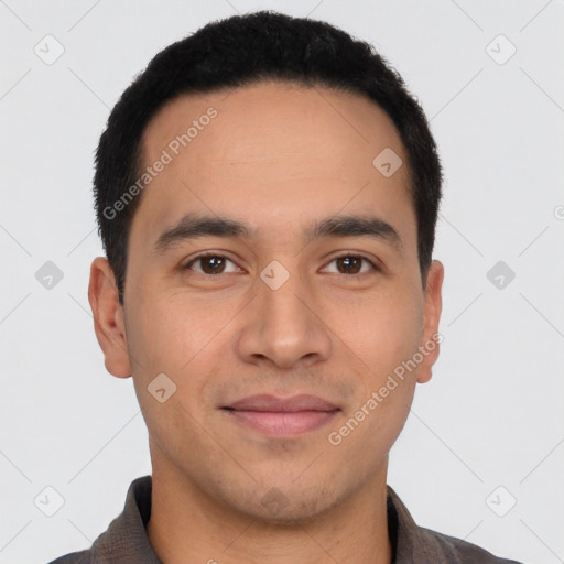 Joyful latino young-adult male with short  black hair and brown eyes