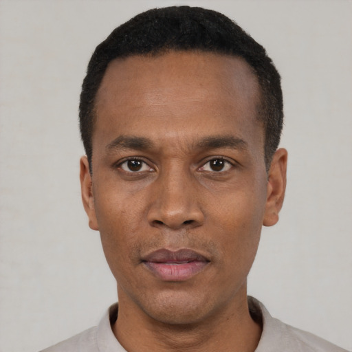 Neutral black adult male with short  black hair and brown eyes