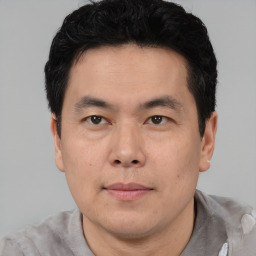 Neutral asian young-adult male with short  black hair and brown eyes