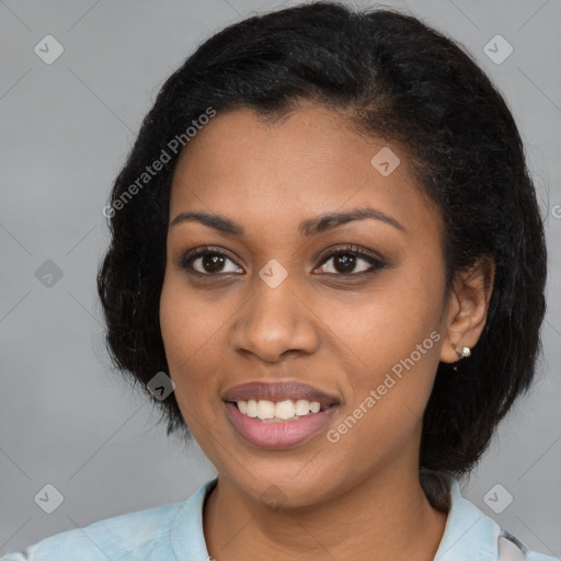 Joyful black young-adult female with medium  black hair and brown eyes