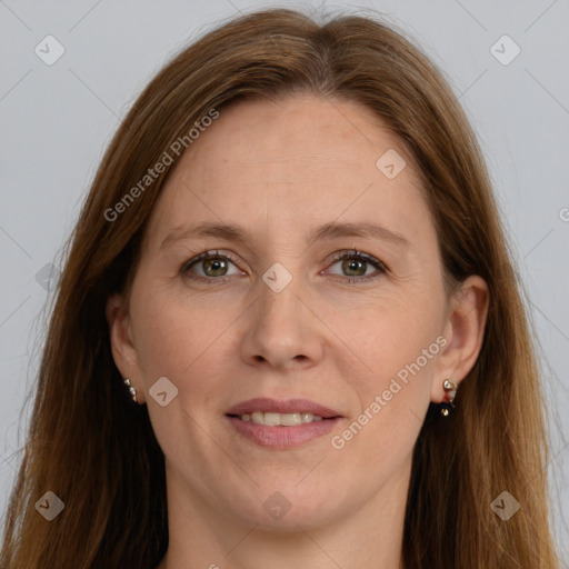 Joyful white adult female with long  brown hair and grey eyes