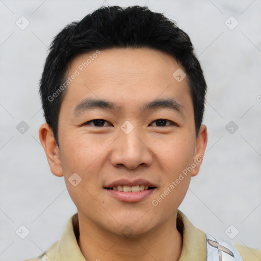 Joyful asian young-adult male with short  black hair and brown eyes