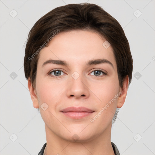 Joyful white young-adult female with short  brown hair and grey eyes