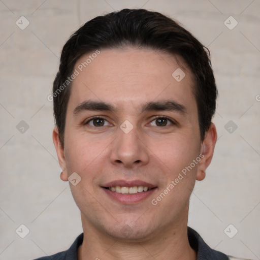 Joyful white young-adult male with short  black hair and brown eyes