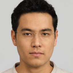 Neutral asian young-adult male with short  black hair and brown eyes