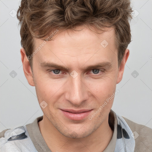 Joyful white adult male with short  brown hair and grey eyes