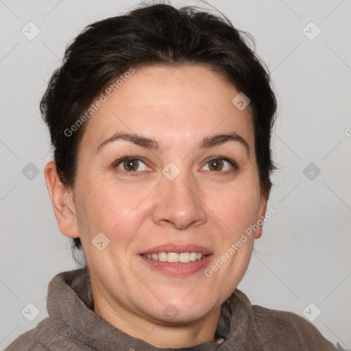 Joyful white adult female with short  brown hair and brown eyes