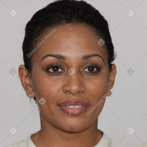 Joyful black young-adult female with short  black hair and brown eyes