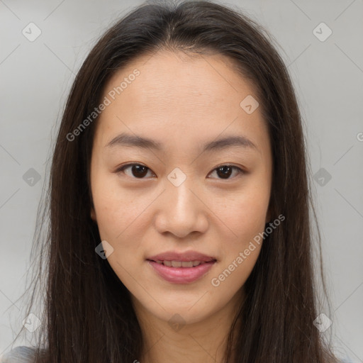 Joyful asian young-adult female with long  brown hair and brown eyes