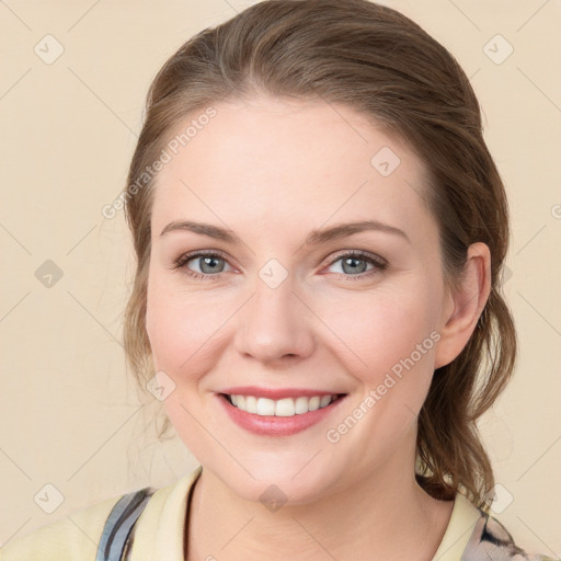 Joyful white young-adult female with medium  brown hair and blue eyes