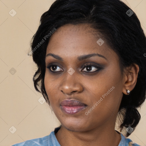 Joyful black young-adult female with medium  black hair and brown eyes