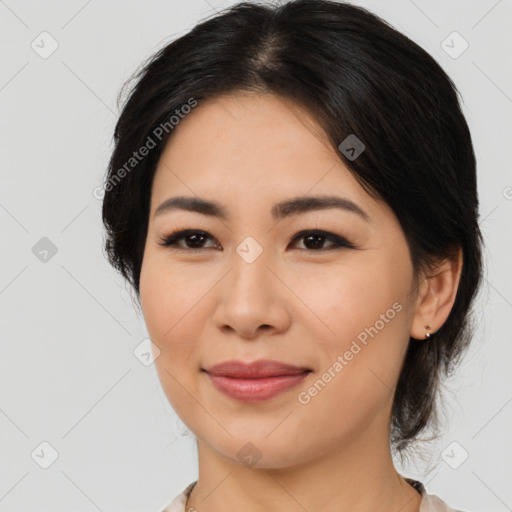 Joyful latino young-adult female with medium  brown hair and brown eyes