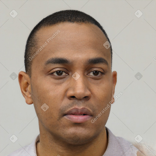 Neutral latino young-adult male with short  black hair and brown eyes