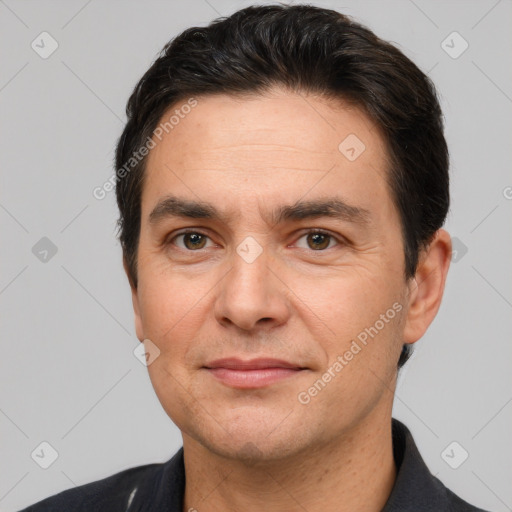 Joyful white adult male with short  brown hair and brown eyes